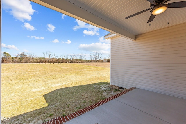 view of yard with ceiling fan