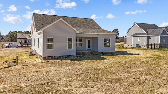 view of front of property featuring a shingled roof, cooling unit, crawl space, and ceiling fan