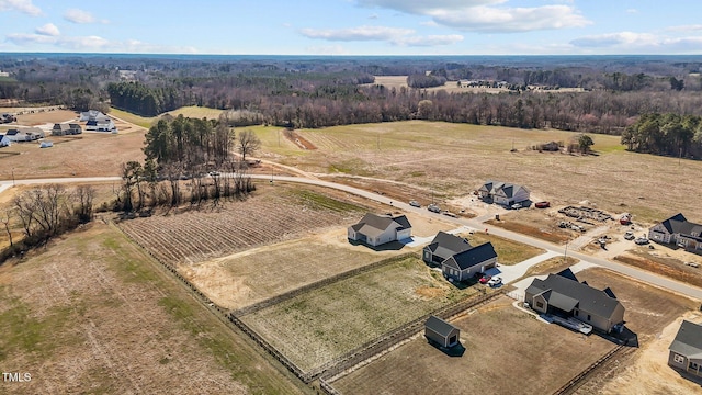 birds eye view of property featuring a rural view