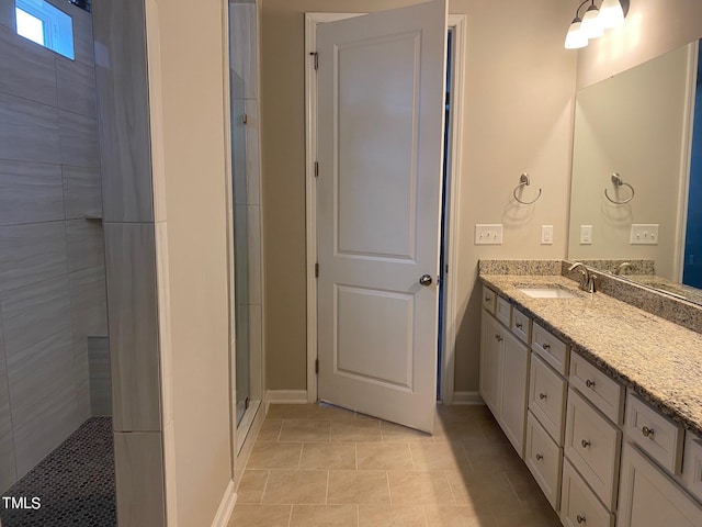 bathroom featuring vanity, tile patterned floors, and walk in shower