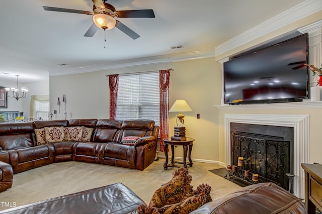 living room with carpet, ornamental molding, and ceiling fan with notable chandelier