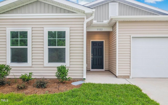 view of exterior entry with a garage