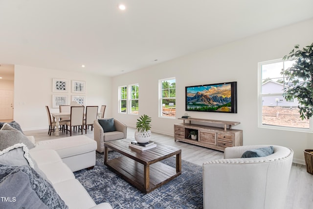 living area with dark wood-style floors, baseboards, and recessed lighting