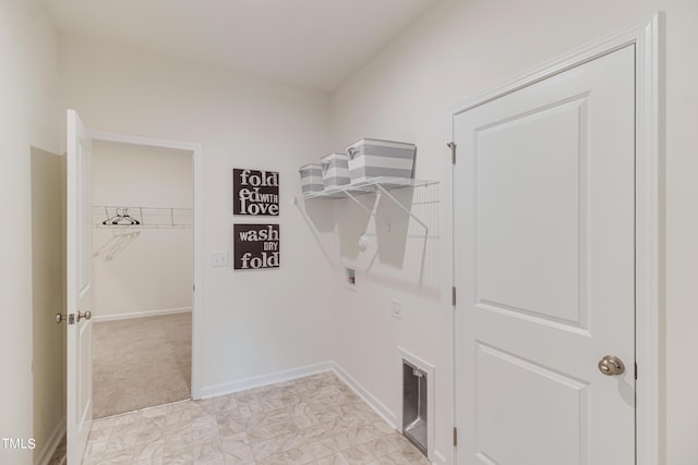 clothes washing area with marble finish floor, laundry area, hookup for a washing machine, and baseboards