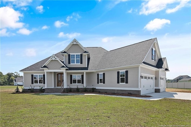 view of front of home featuring a porch, a garage, and a front lawn