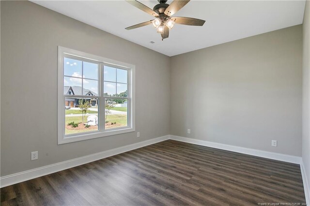 unfurnished room featuring dark hardwood / wood-style flooring and ceiling fan