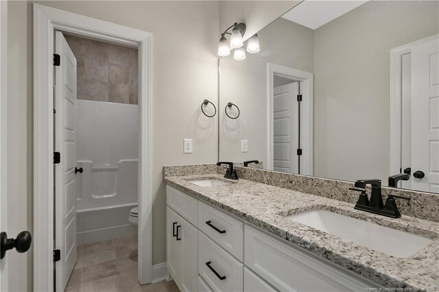 full bathroom with vanity, toilet, shower / bath combination, and tile patterned floors