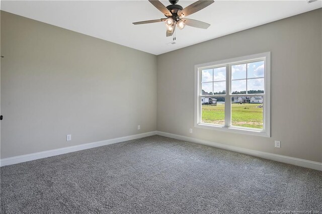 empty room featuring carpet flooring and ceiling fan