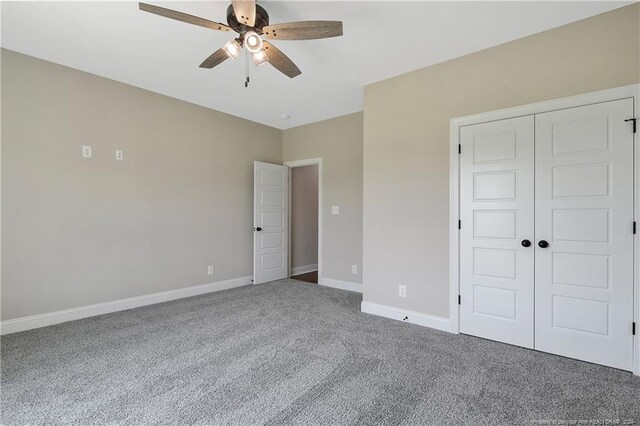 unfurnished bedroom featuring a closet, ceiling fan, and carpet flooring