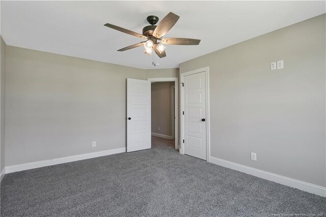 interior space featuring ceiling fan and carpet floors