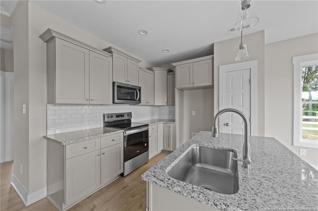 300 Fields Rd Lot 5, Pikeville, NC 27863 - kitchen with plenty of natural light, stainless steel appliances, sink, and decorative light fixtures