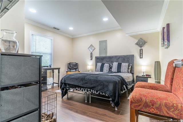 bedroom featuring crown molding and hardwood / wood-style flooring