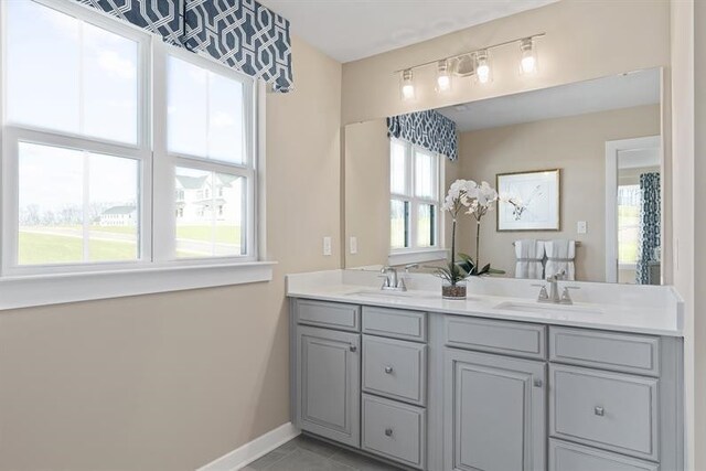 bathroom with tile patterned flooring and vanity