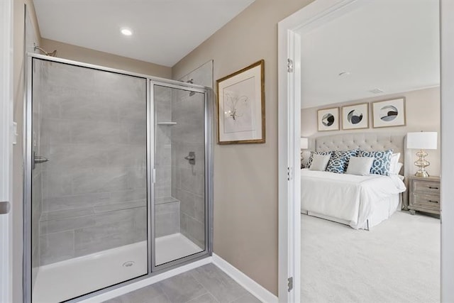 bathroom featuring a shower with shower door