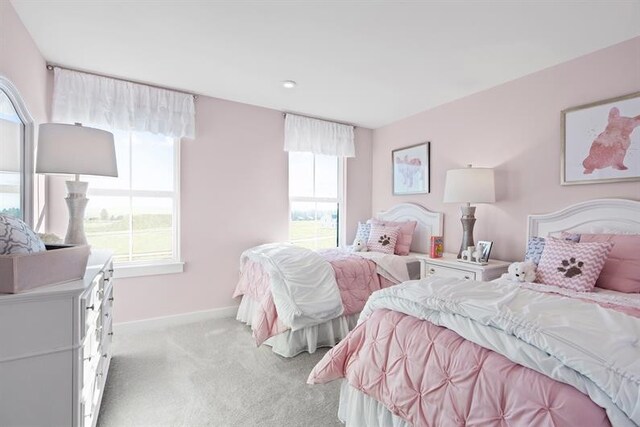 bedroom with light colored carpet