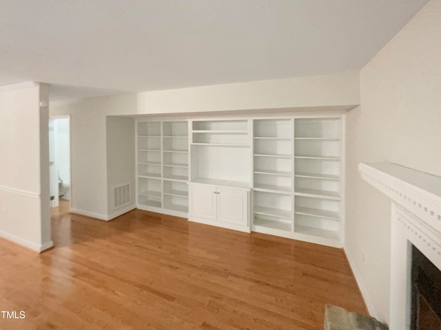 unfurnished living room with light hardwood / wood-style floors