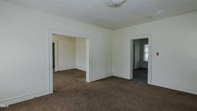 unfurnished room featuring carpet