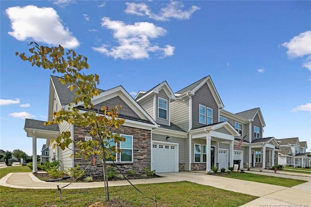 view of front of home with a garage and a front lawn