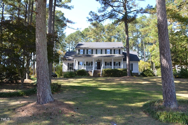 colonial inspired home featuring a front lawn and a porch