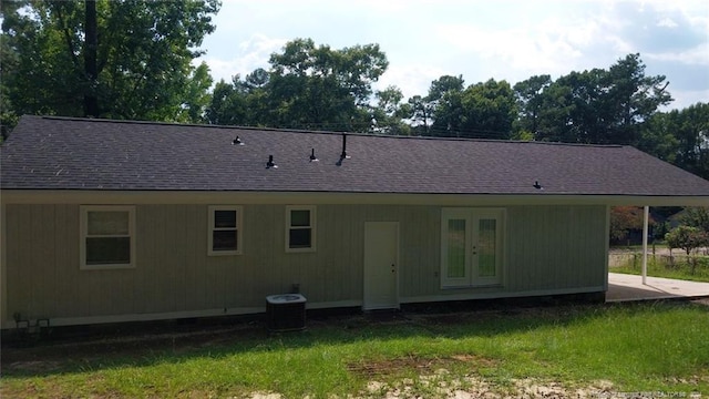 back of house featuring central air condition unit