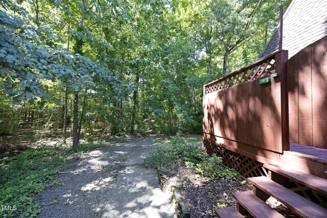 exterior space featuring a forest view