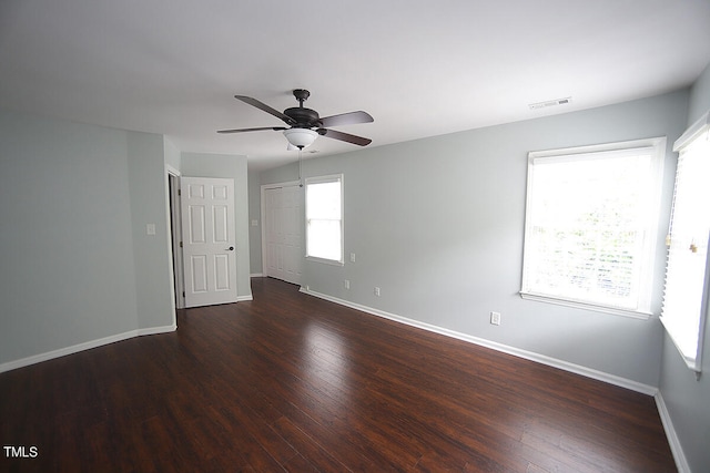 unfurnished room featuring ceiling fan and dark hardwood / wood-style flooring