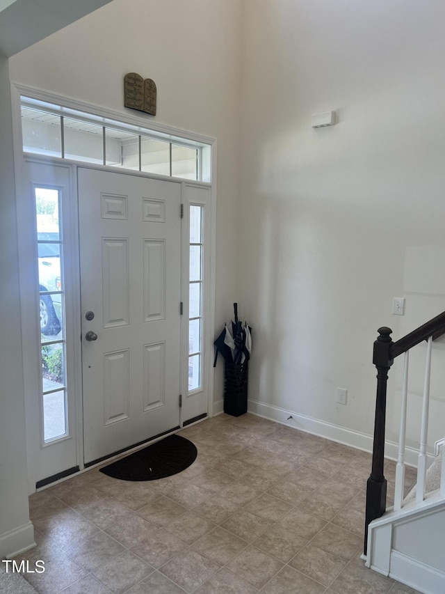 1565 Sage Treee Dr, Zebulon, NC 27597 - foyer entrance with baseboards and stairs
