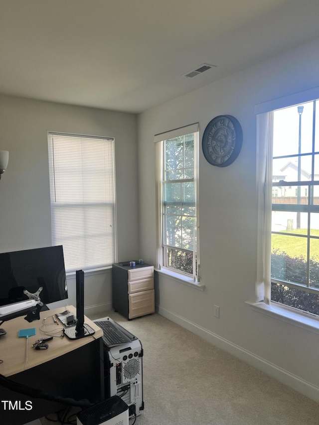 1565 Sage Treee Dr, Zebulon, NC 27597 - office with a healthy amount of sunlight, baseboards, light colored carpet, and visible vents