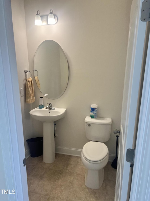 1565 Sage Treee Dr, Zebulon, NC 27597 - bathroom featuring baseboards, tile patterned flooring, and toilet