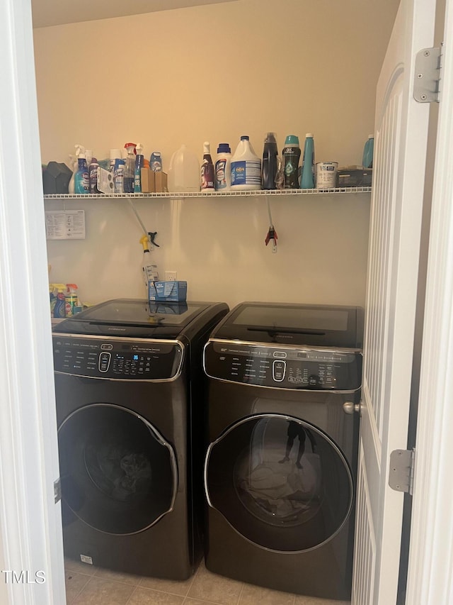 1565 Sage Treee Dr, Zebulon, NC 27597 - washroom featuring laundry area, washer and clothes dryer, and tile patterned floors