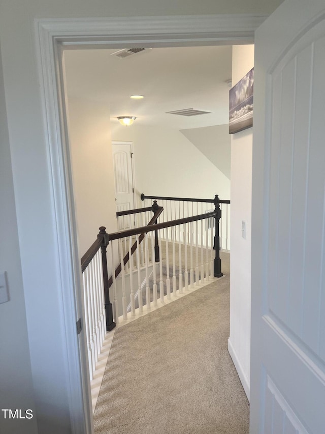1565 Sage Treee Dr, Zebulon, NC 27597 - hall with visible vents, carpet flooring, and an upstairs landing