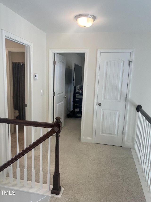 1565 Sage Treee Dr, Zebulon, NC 27597 - hallway with an upstairs landing and light carpet
