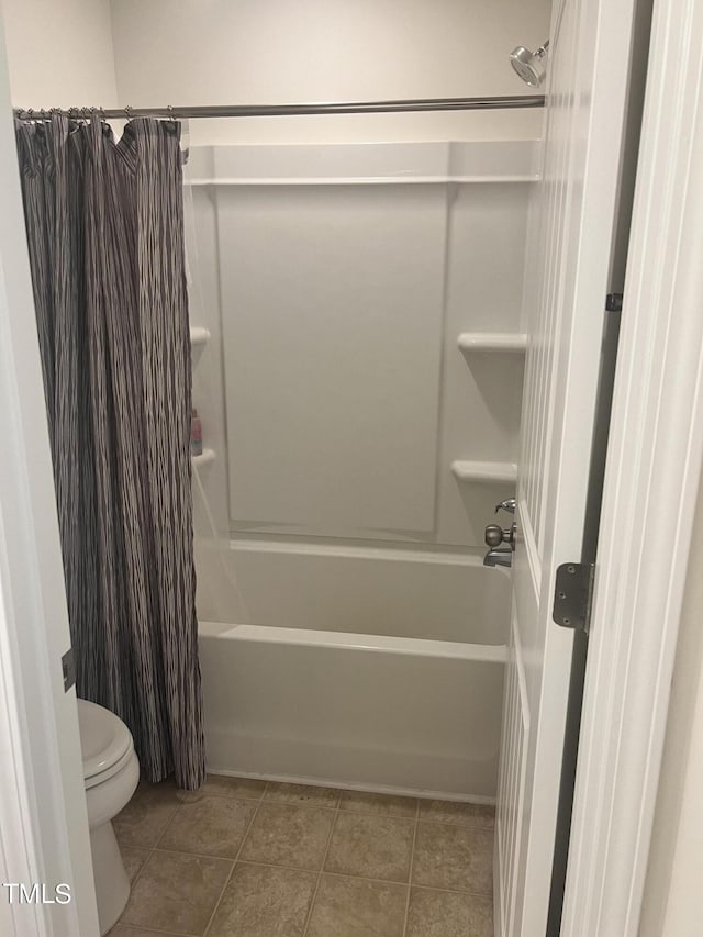 1565 Sage Treee Dr, Zebulon, NC 27597 - bathroom with toilet, tile patterned flooring, and shower / tub combo