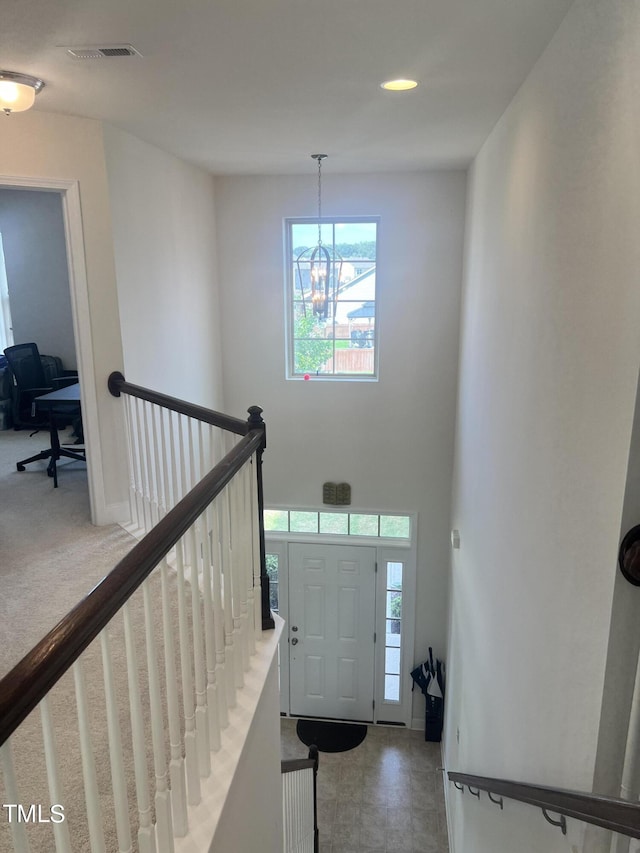 1565 Sage Treee Dr, Zebulon, NC 27597 - foyer with a notable chandelier, visible vents, and a wealth of natural light
