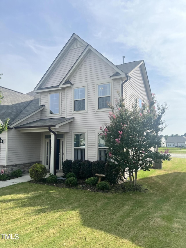 1565 Sage Treee Dr, Zebulon, NC 27597 - traditional-style house featuring a front lawn