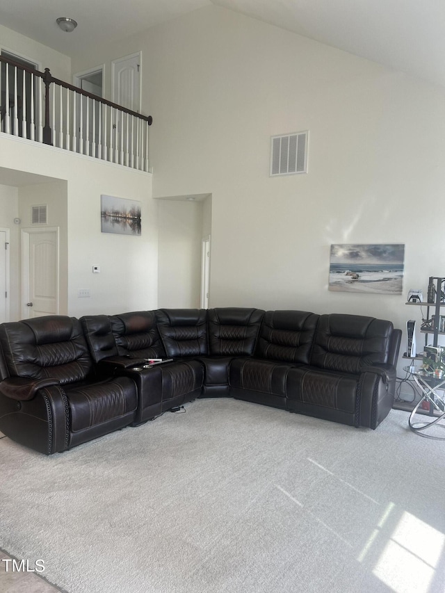 1565 Sage Treee Dr, Zebulon, NC 27597 - carpeted living area featuring high vaulted ceiling and visible vents