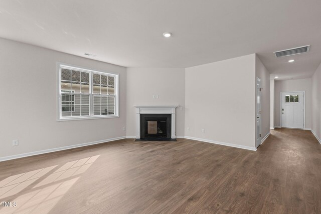 unfurnished living room with hardwood / wood-style floors