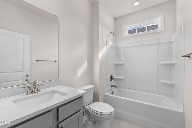 full bathroom with tile patterned flooring, vanity, toilet, and  shower combination