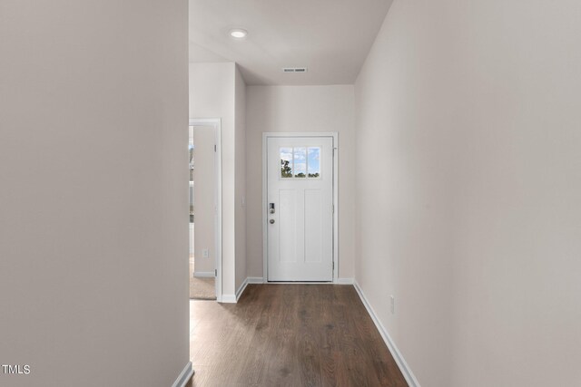 hallway with dark wood-type flooring