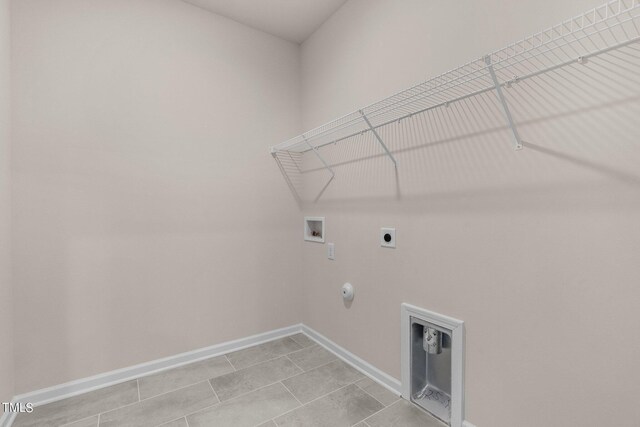 washroom featuring hookup for a washing machine, hookup for a gas dryer, electric dryer hookup, and light tile patterned flooring