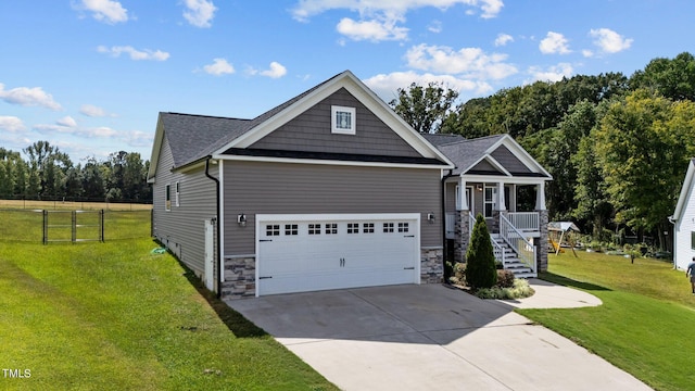 craftsman house featuring a front lawn and a porch