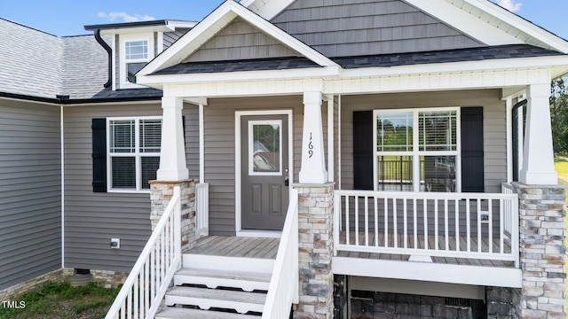 property entrance with covered porch