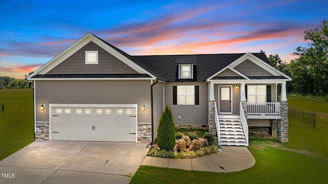 craftsman house with a lawn and covered porch