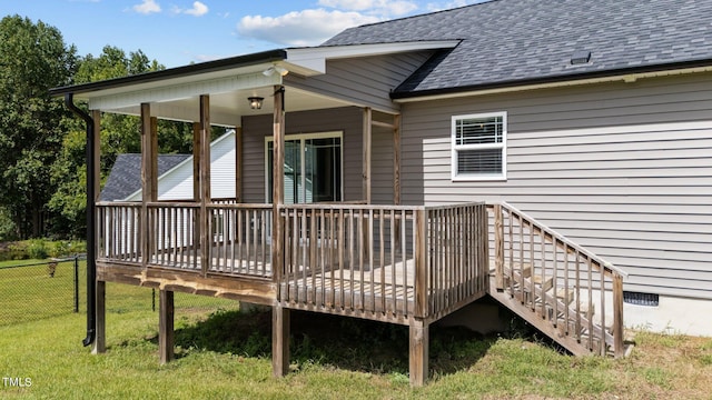 wooden terrace with a yard