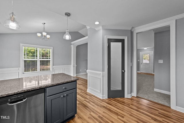 kitchen featuring dishwasher, dark stone counters, lofted ceiling, and light hardwood / wood-style flooring