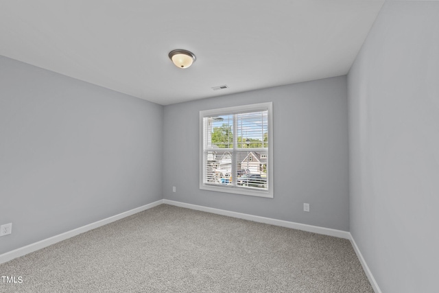 unfurnished room with carpet floors