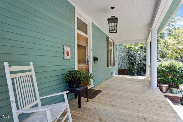 wooden terrace featuring a porch