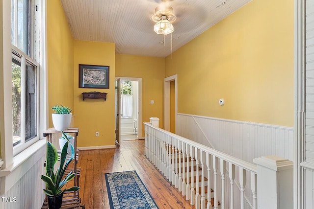 214 College St, Oxford, NC 27565 - hall with a wainscoted wall, an upstairs landing, light wood finished floors, and a wealth of natural light