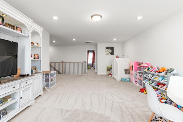 game room featuring light colored carpet, visible vents, and recessed lighting