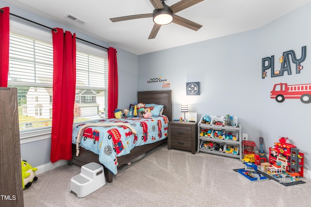 bedroom featuring a ceiling fan, baseboards, visible vents, and carpet flooring